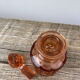 Art Deco perfume bottle in old amber pink glass