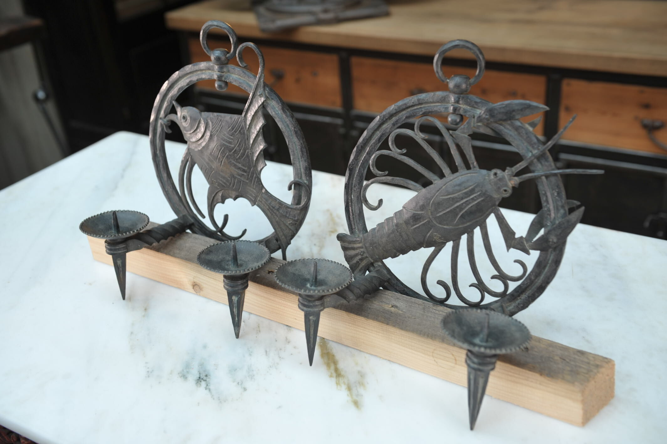 Pair of carved metal wall lamps signed RG