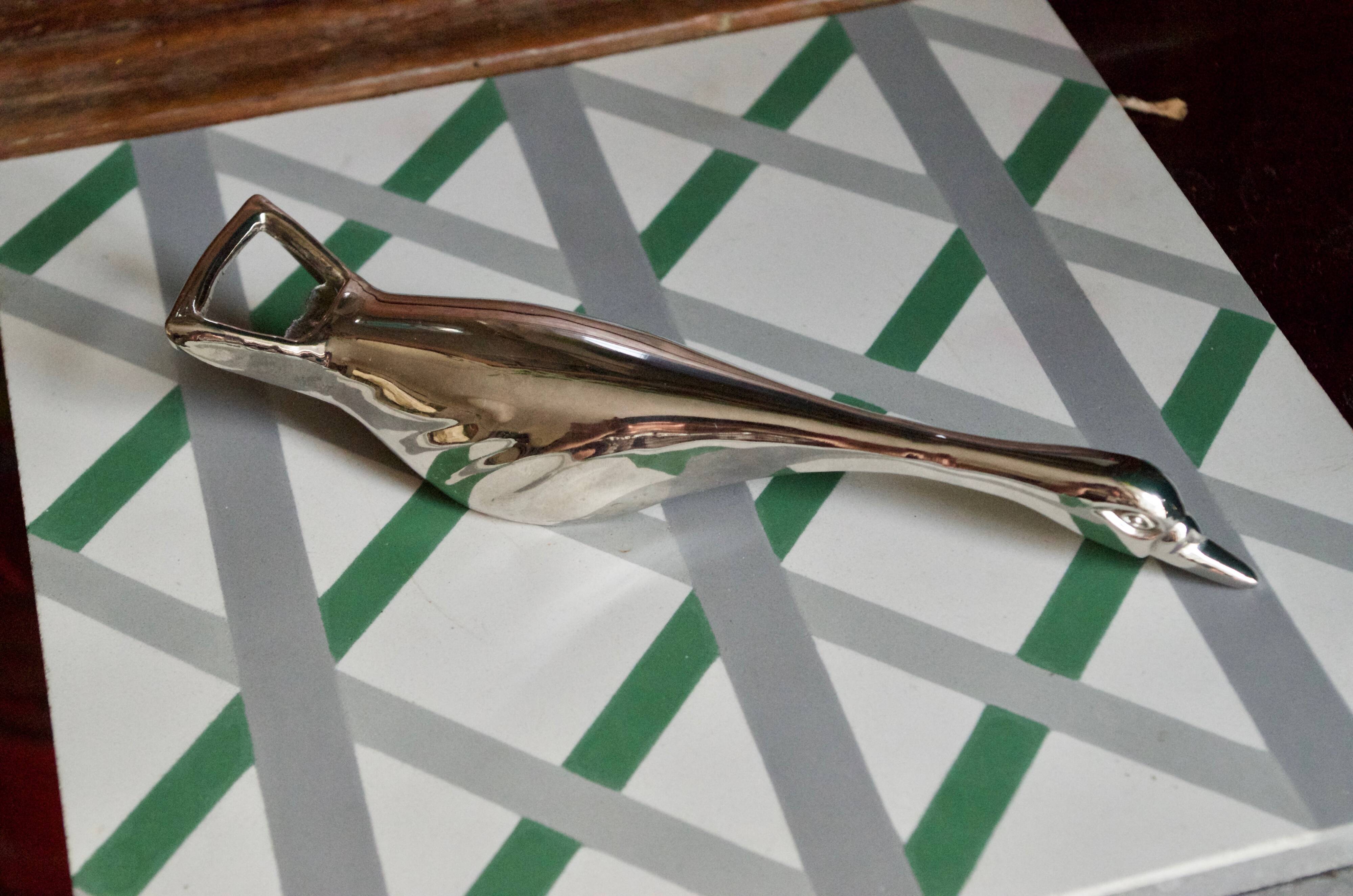 Vintage goose in flight bottle opener in silver metal
