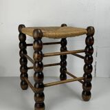 Brutalist wood turned bobbin rush stool in the style of Charles Dudouyt