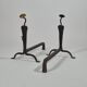 Pair of handforged metal and brass andirons