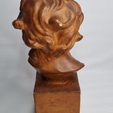 Bust of a laughing child in patinated plaster, 35 cm
