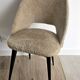 Pair of vintage barrel chairs in boucle fabric with brass splayed legs.