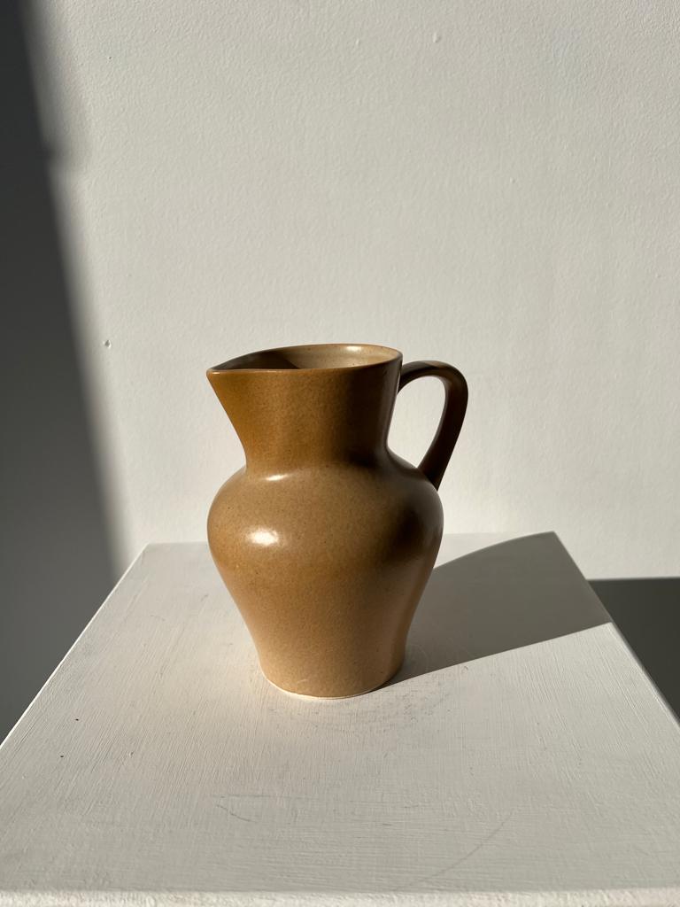 Small pitcher in light beige sandstone