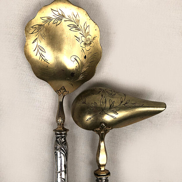 Set of three silver metal service cutlery