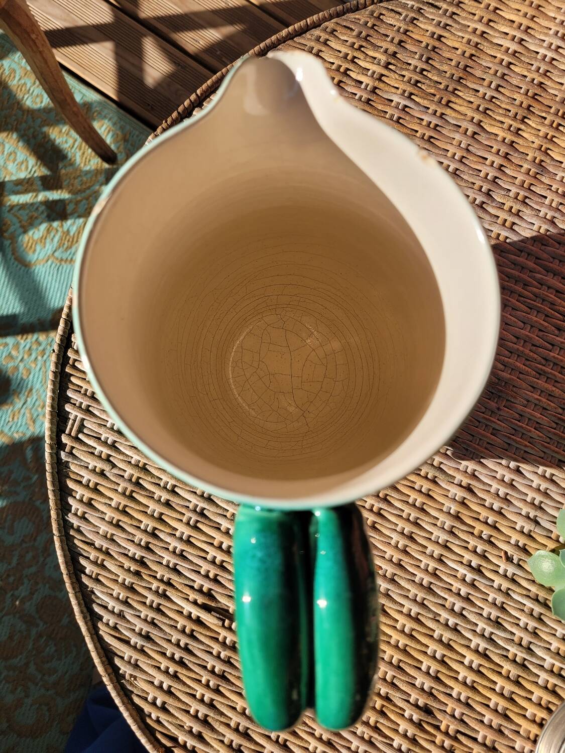 Green glazed ceramic pitcher