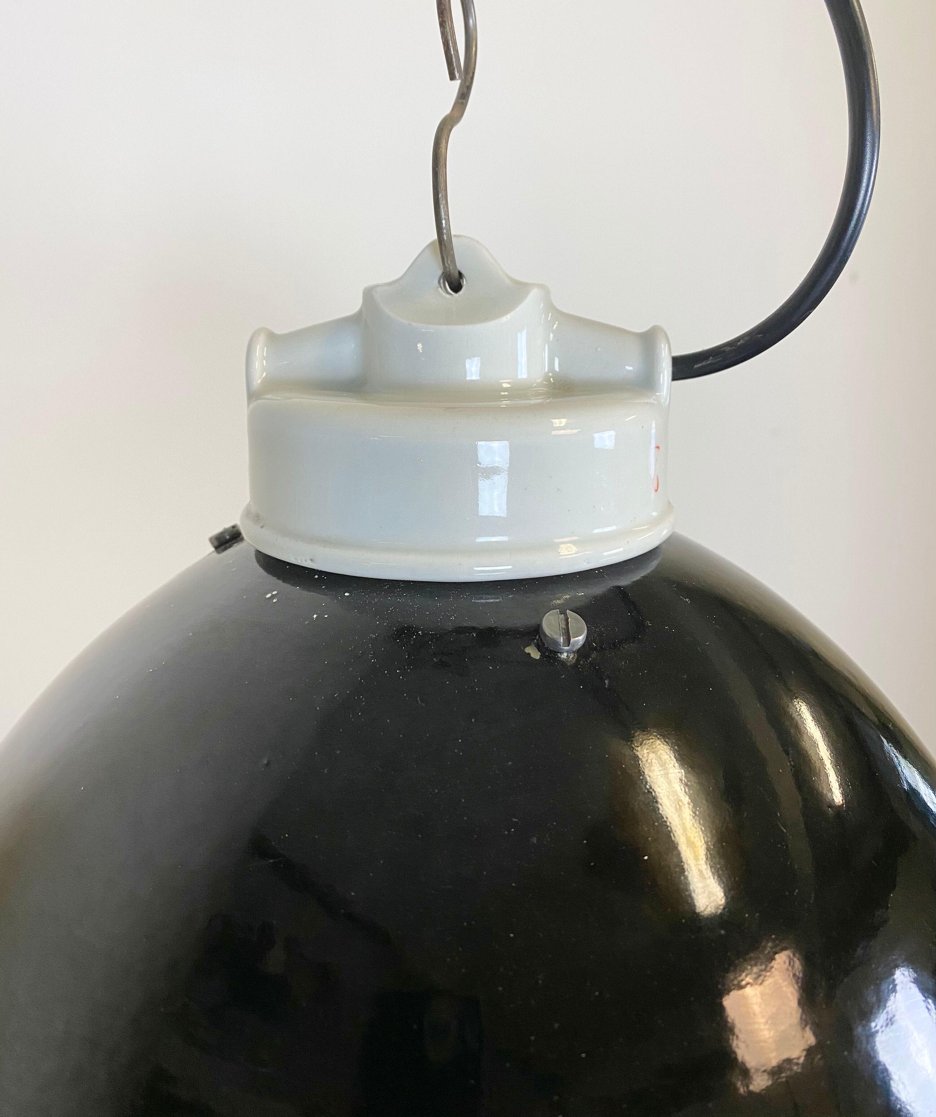 Industrial black enamel lamp with porcelain top, 1950s