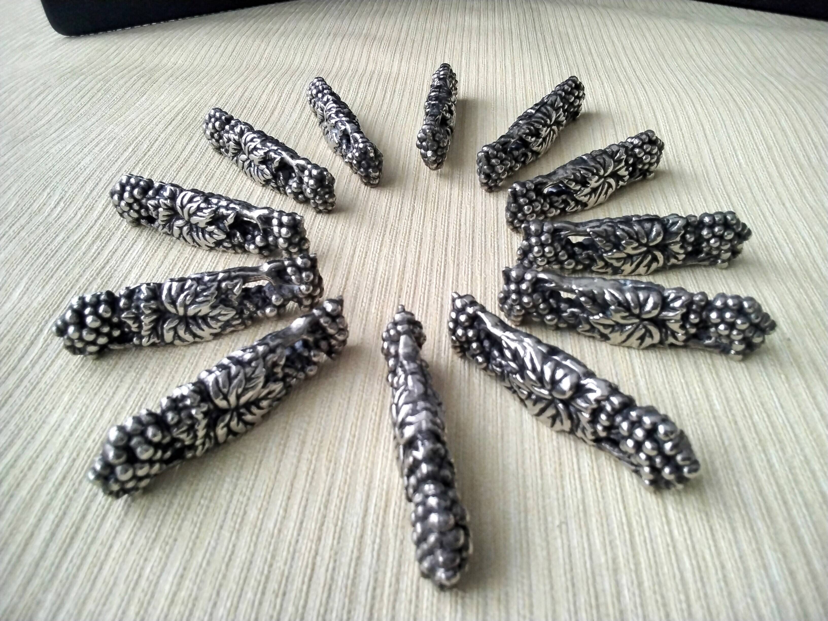 12 Metal knife holders with bunches of grapes and vine leaves