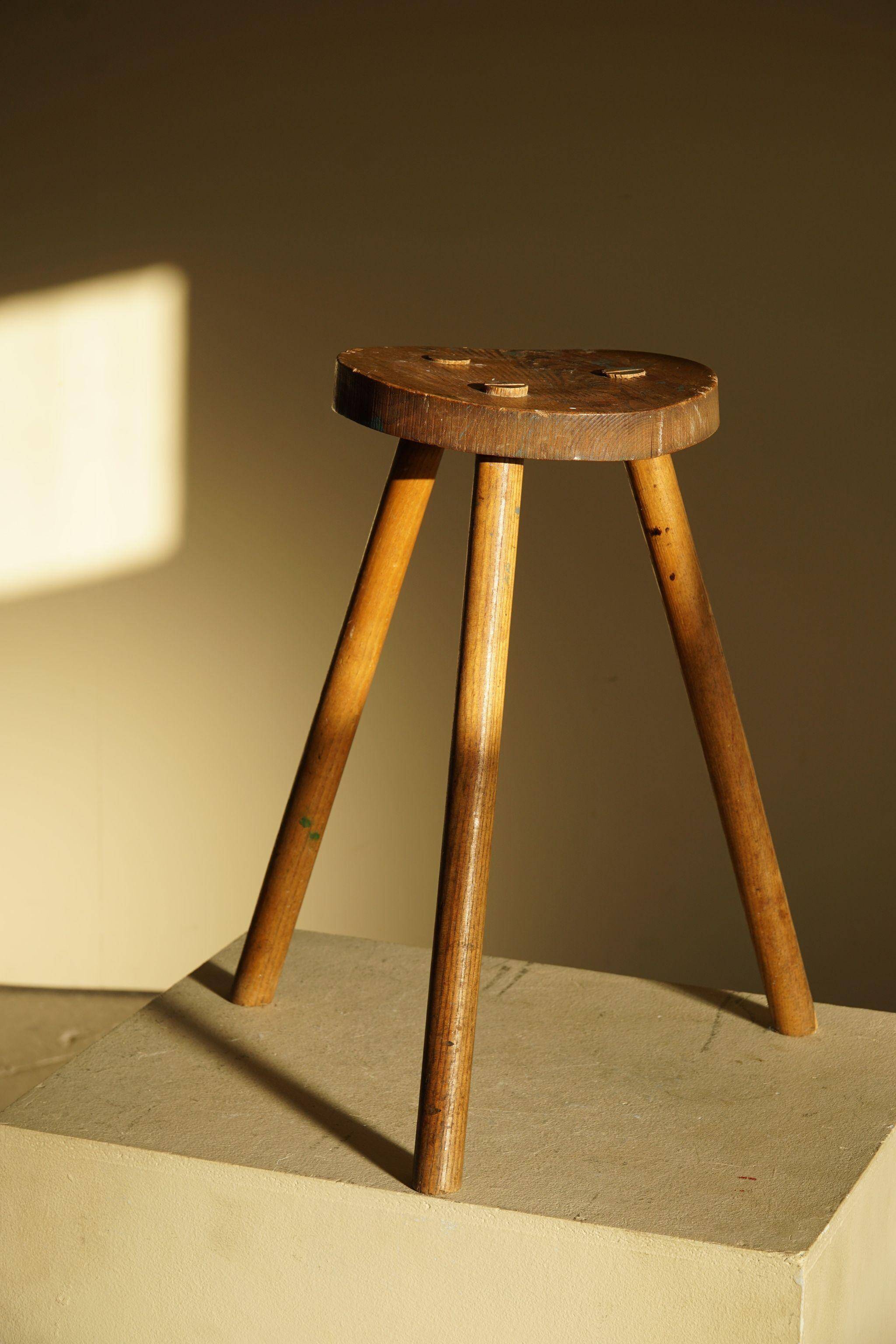 Tripod stool made of solid oak, by a Danish cabinetmaker, mid-century, around 1960.