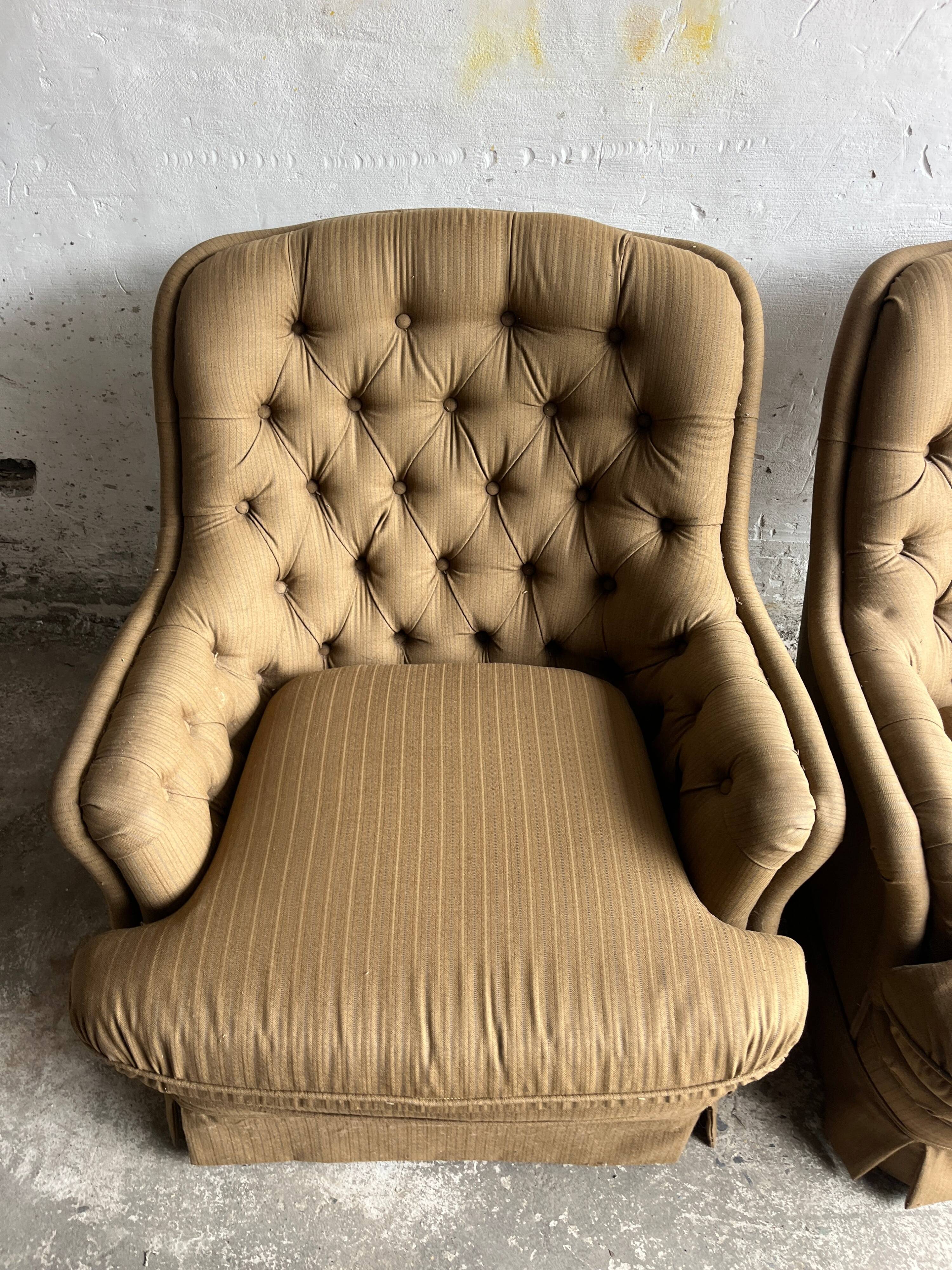 Pair of upholstered lounge chairs with ottoman, 1970s