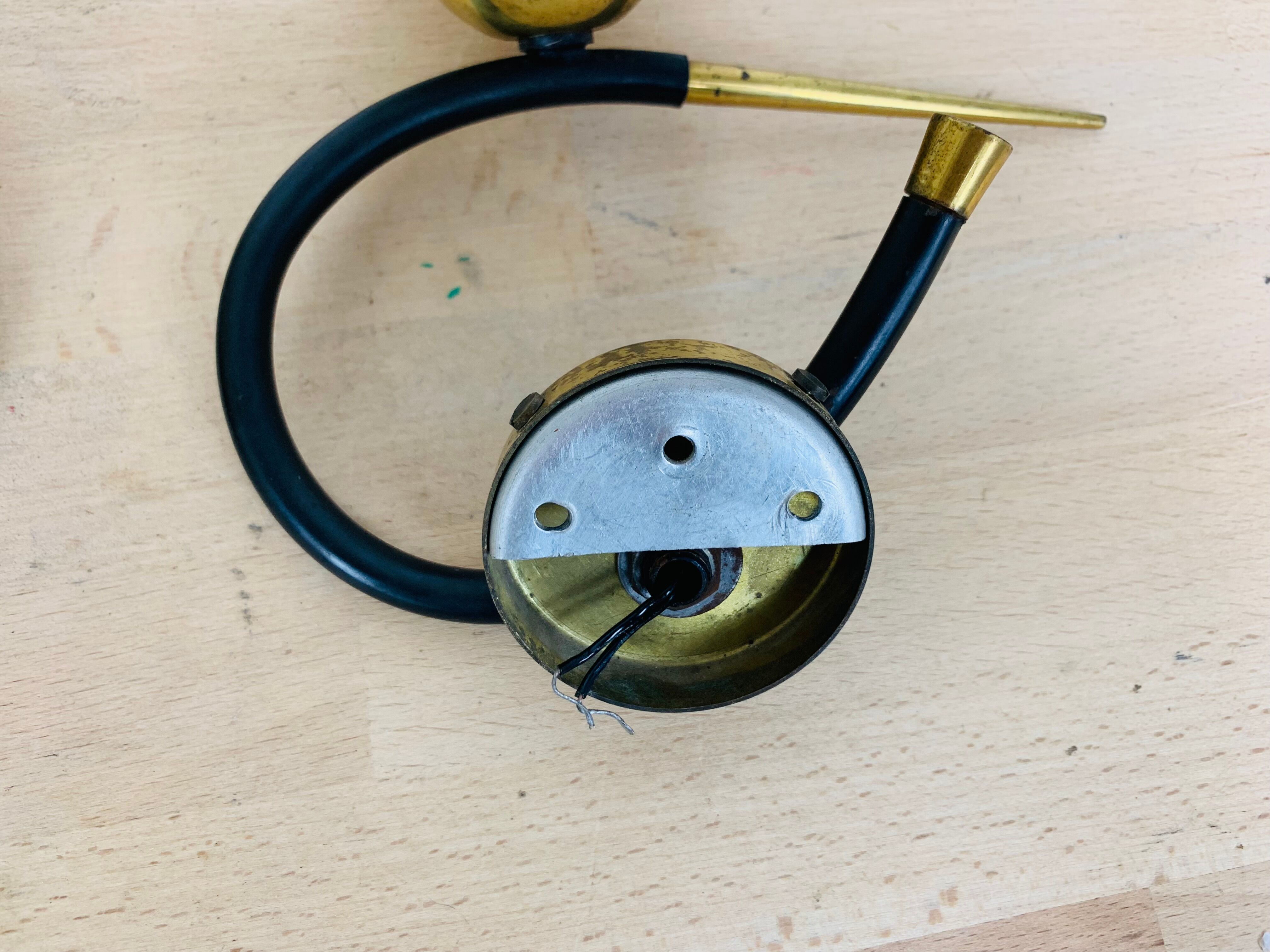 Pair of Arlus 50s opaline black and golden brass wall lamps