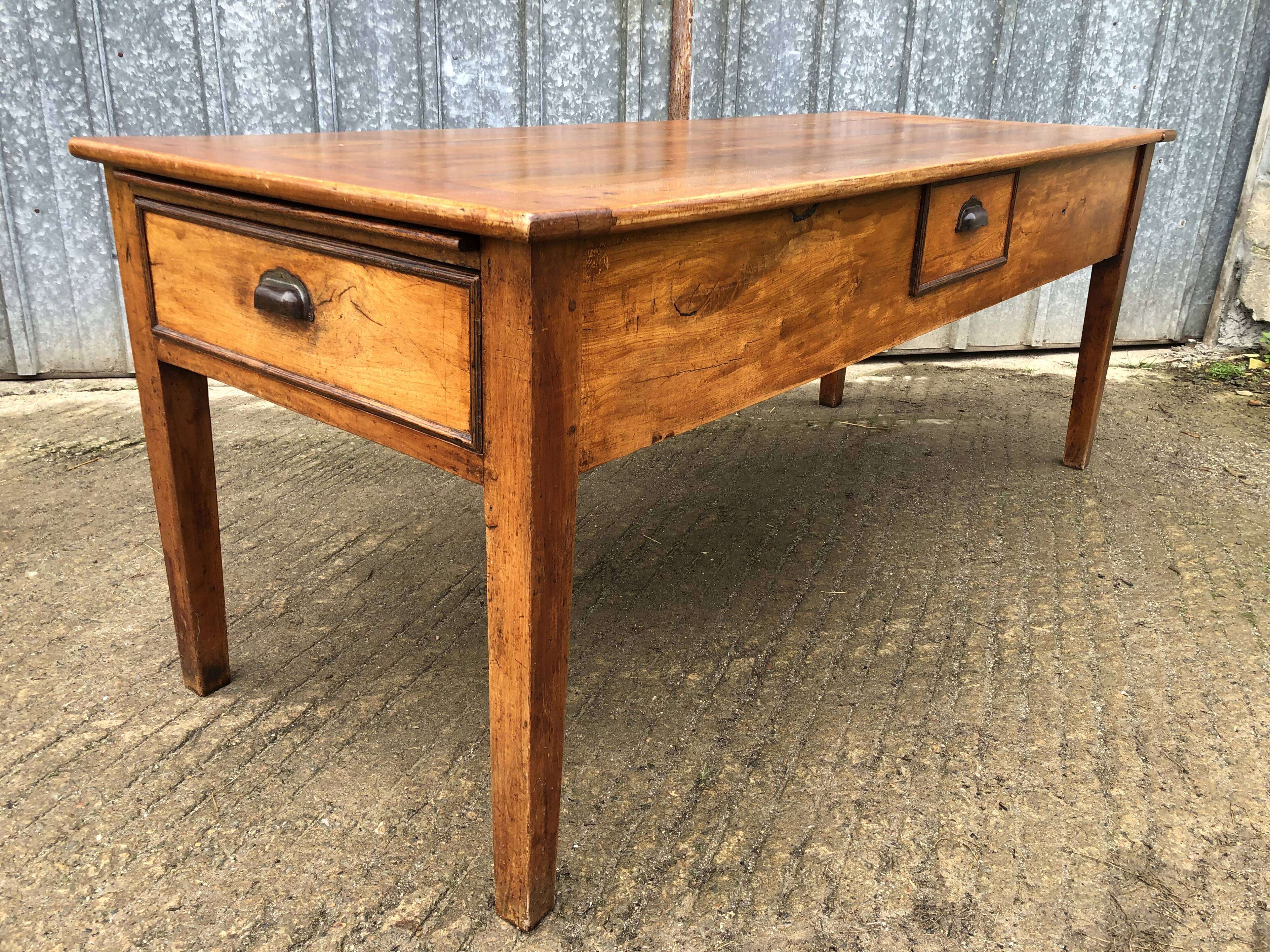 Antique farmhouse table in solid cherry wood with 3 drawers and 1 pull-out.