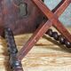 Antique stool in turned and carved solid wood