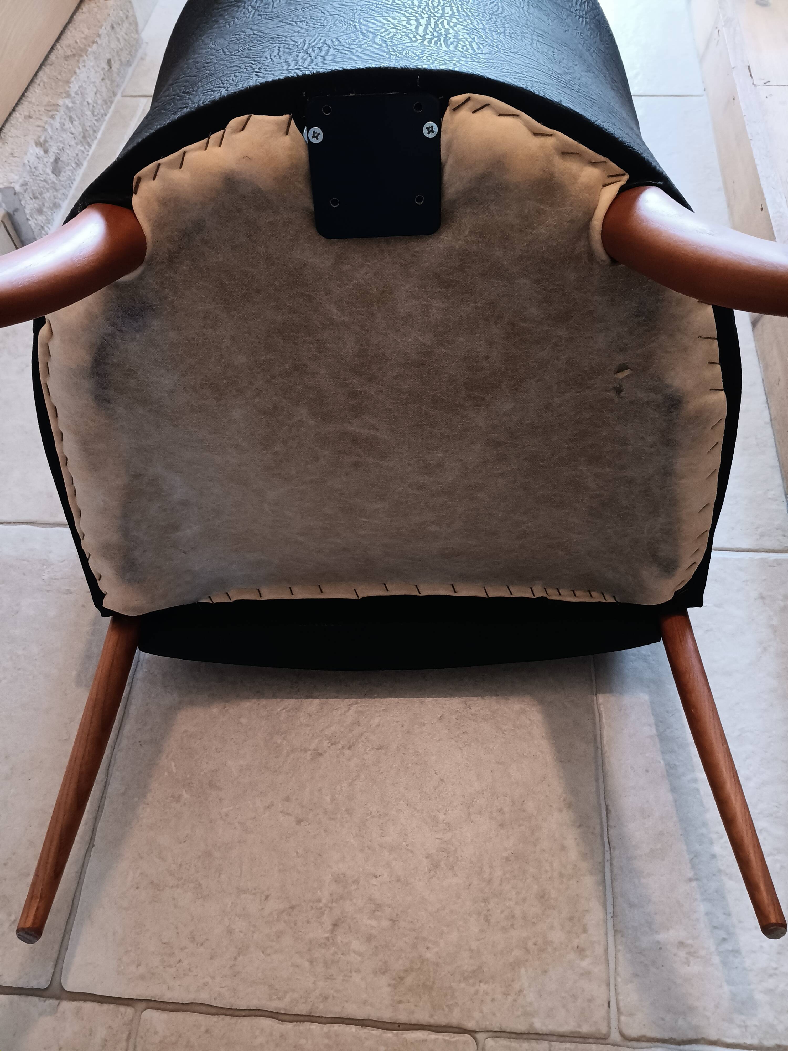 Pair of leather and wood armchairs in the Umberto Asnago style.