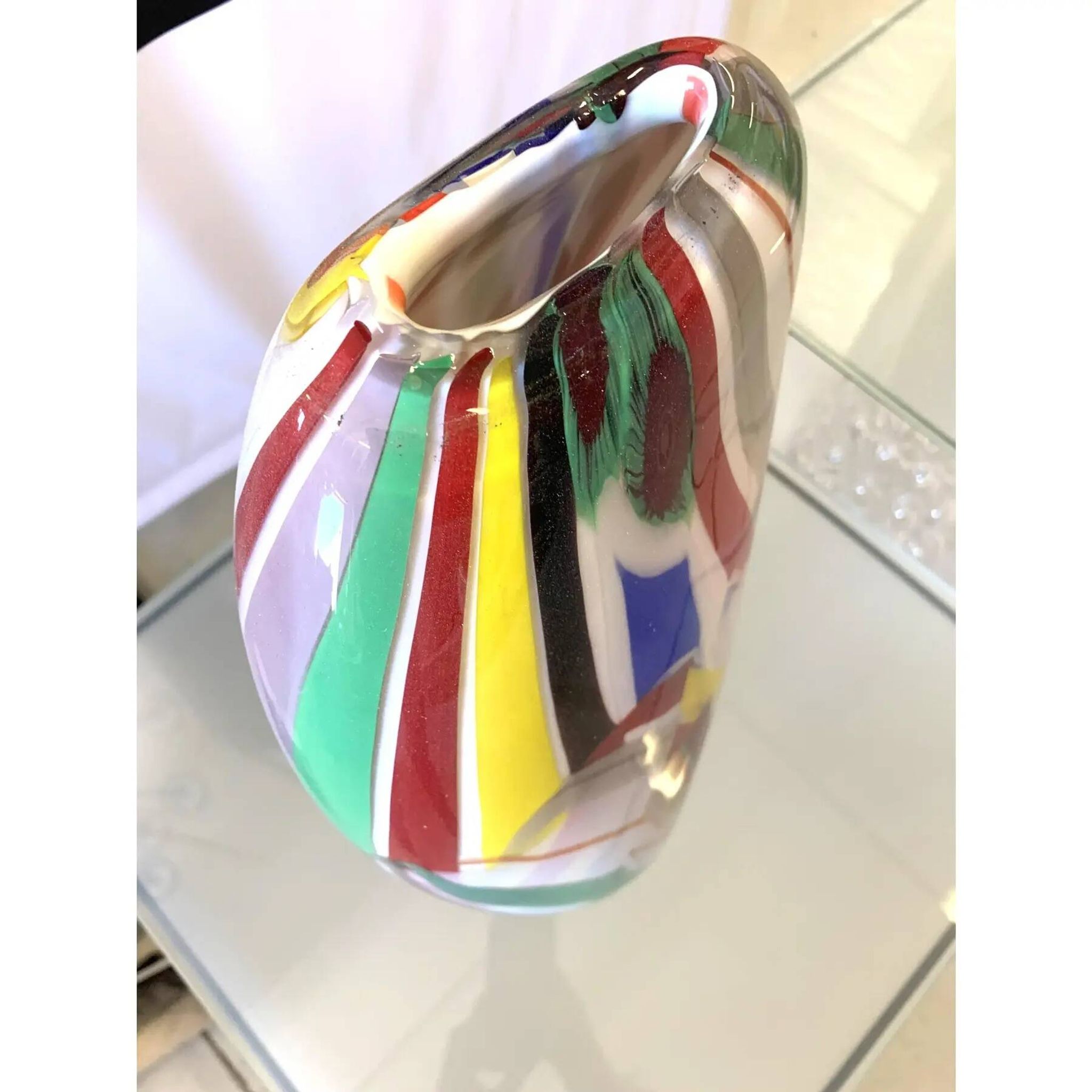 Abstract vase in milky-white Murano-inspired glass with multicoloured reeds.
