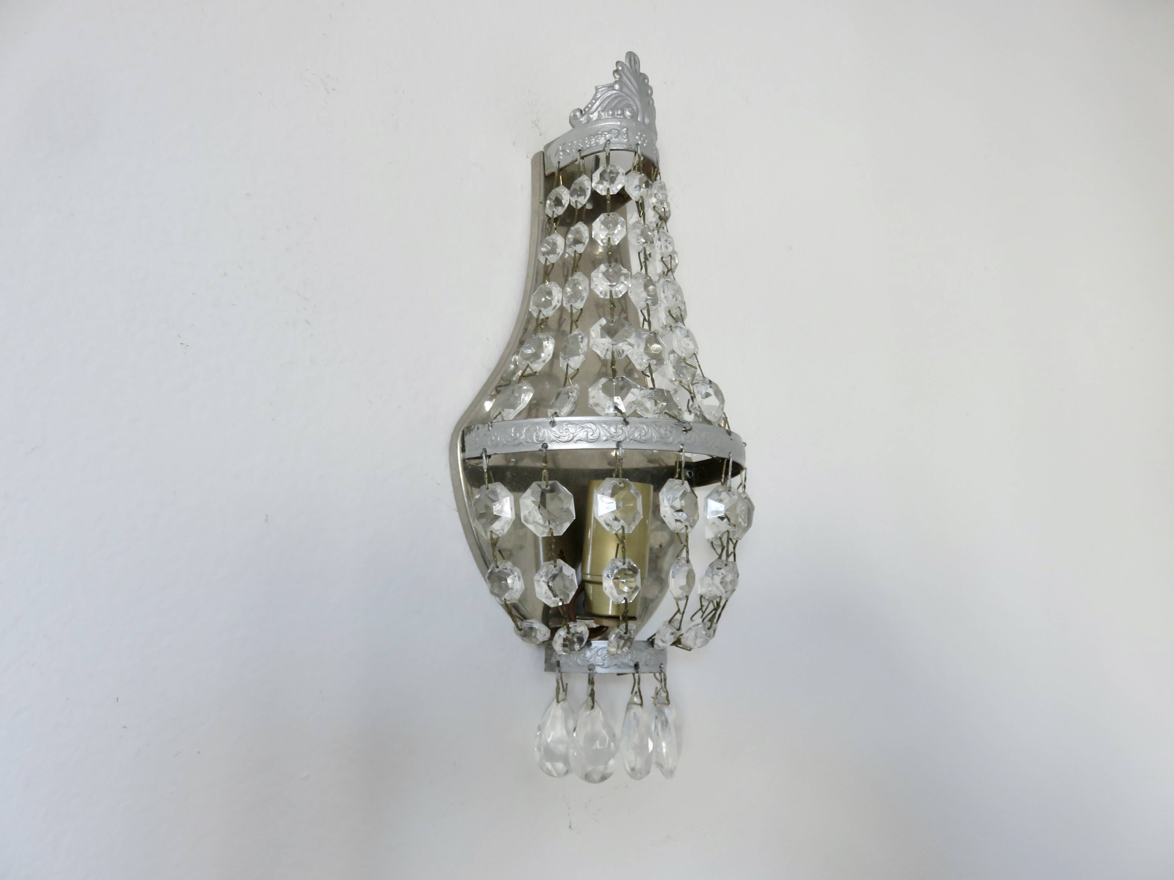 Pair of silver-plated balloon wall lights with pendants, circa 1970.