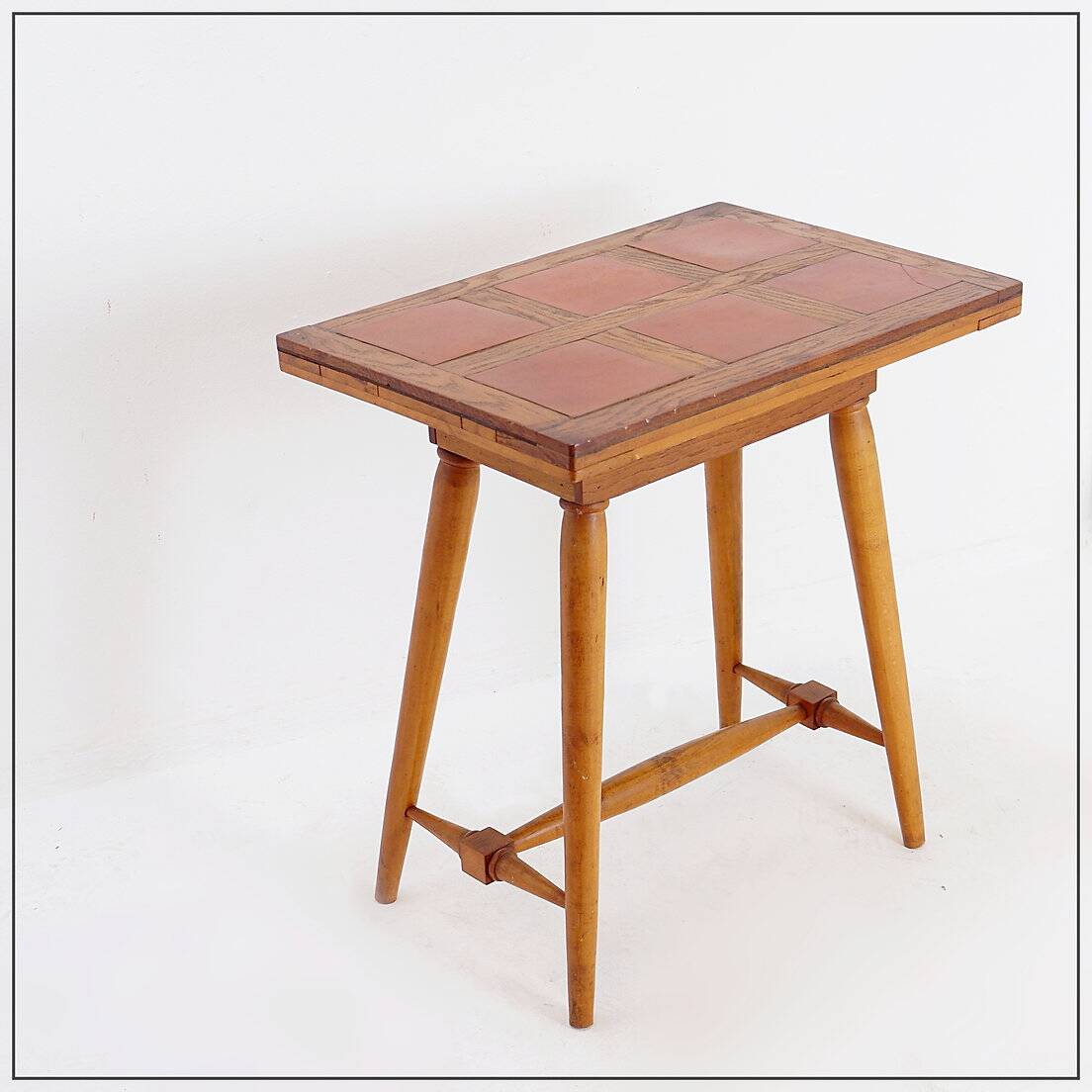 Vintage wooden side table with terracotta top