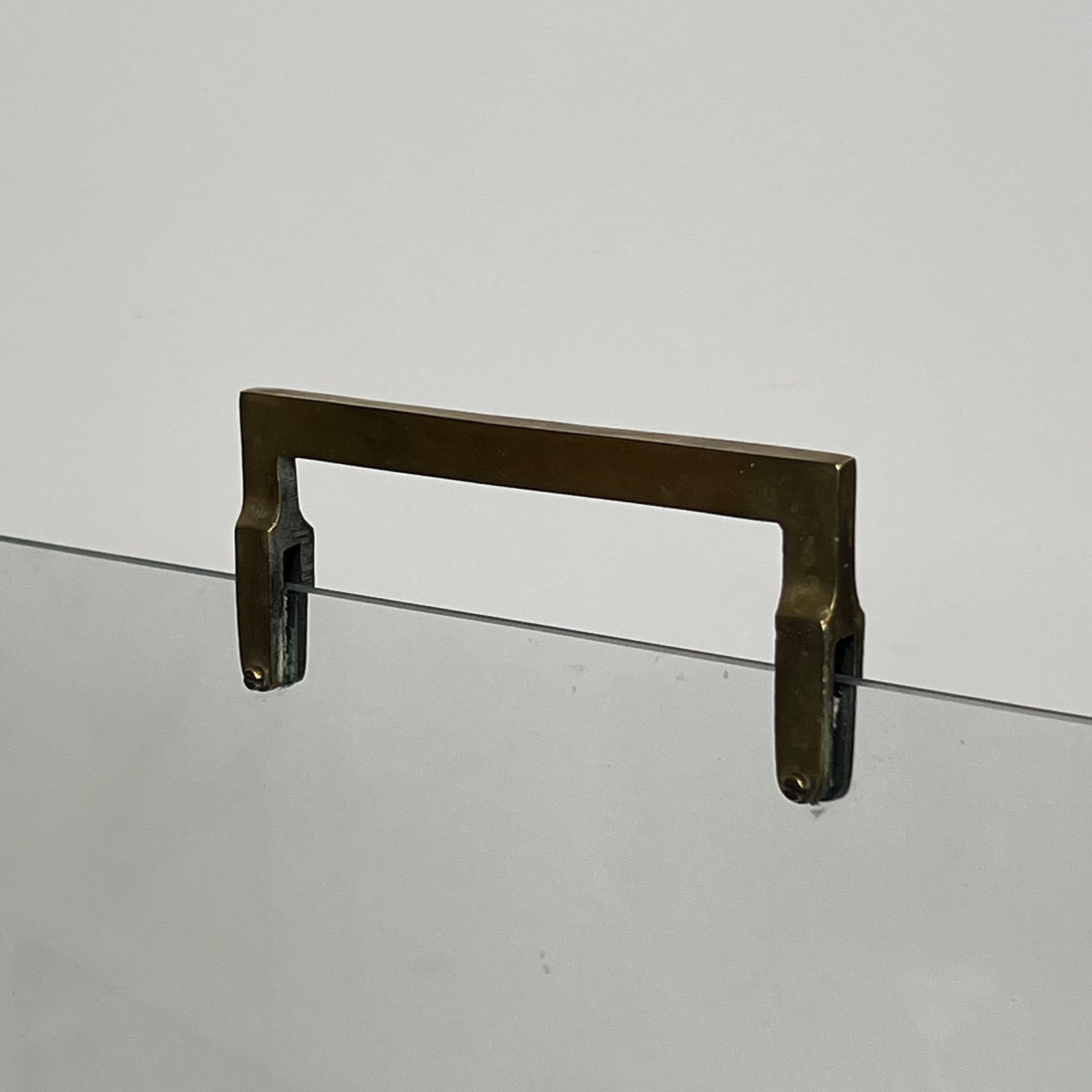 Glass and brass fire screen