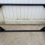 Vintage black tubular coffee table with smoked glass by Yves Boutboul, 1980.