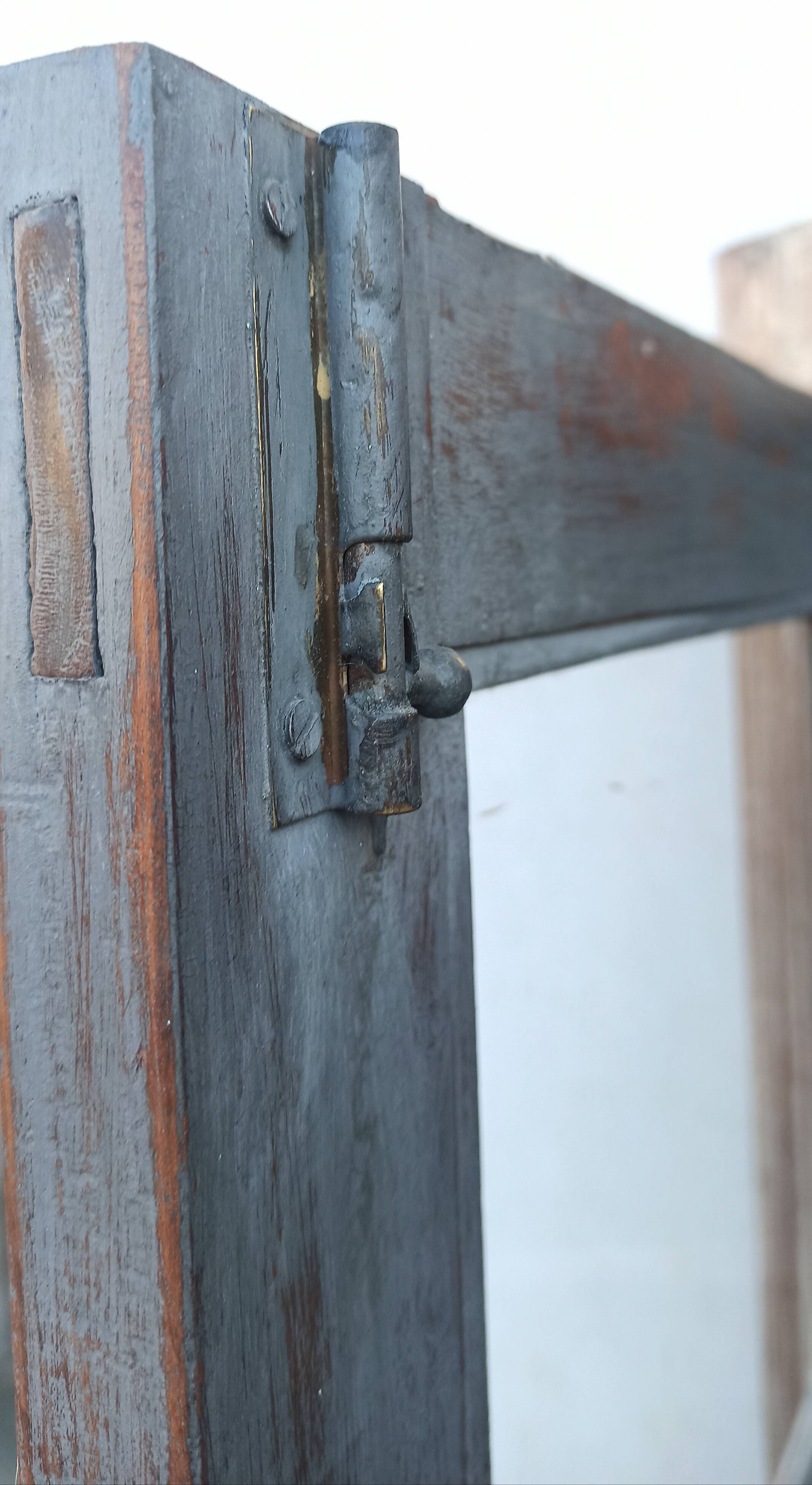 Glass cabinet in old whitewashed wood