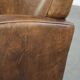 Sheepskin armchair in a light cognac colour with matching piping