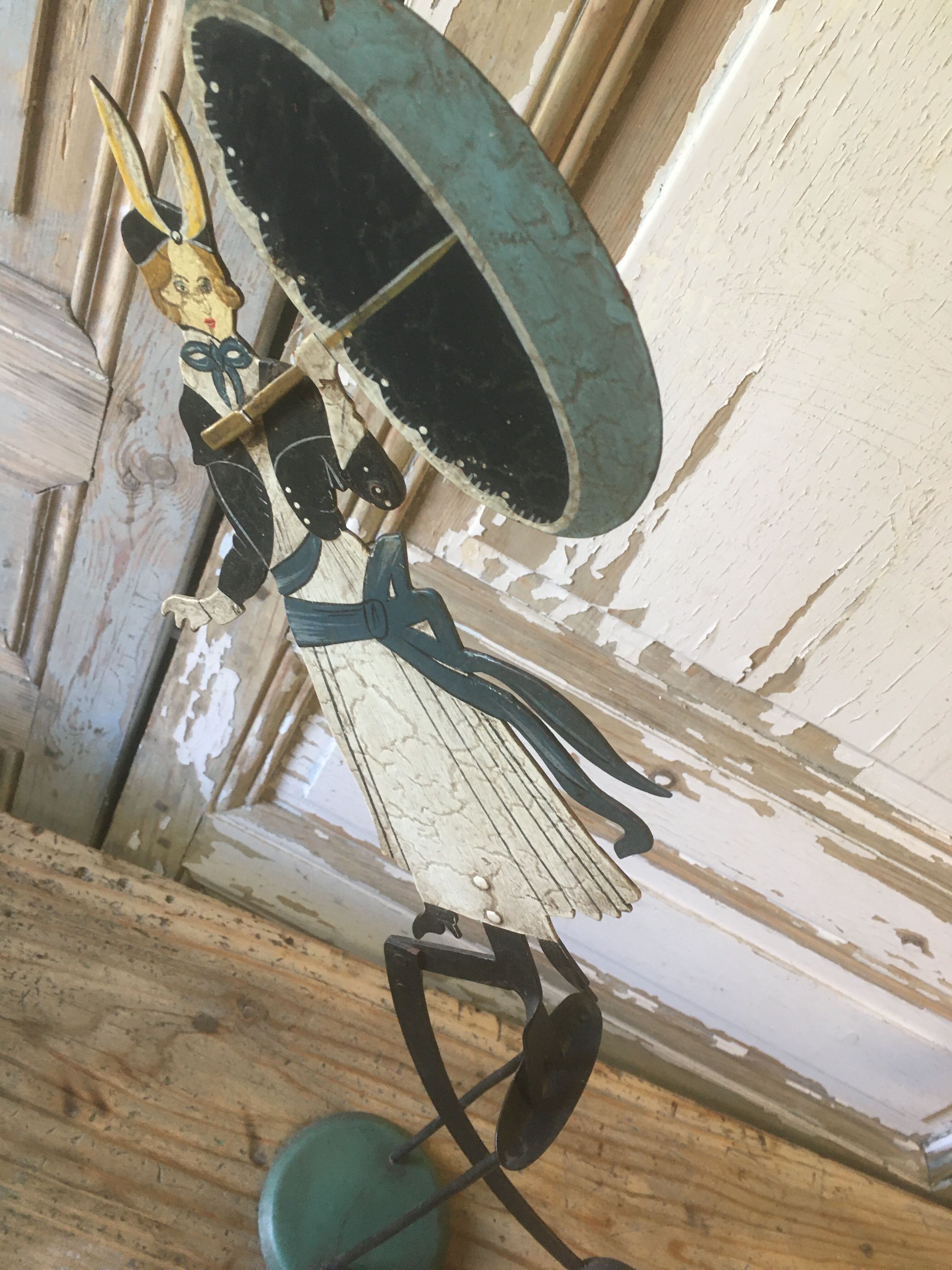 Woman with metal umbrella, pendulum