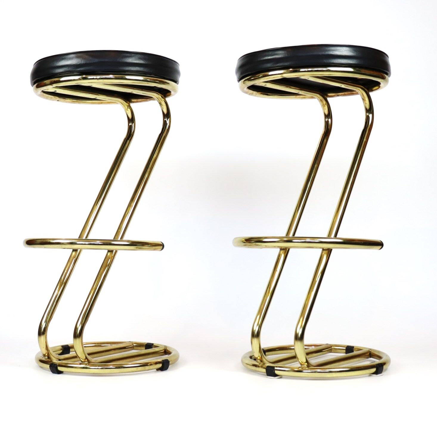 Pair of high brass stools