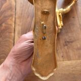 Pair of bronze wall sconces with outstretched arms and hands