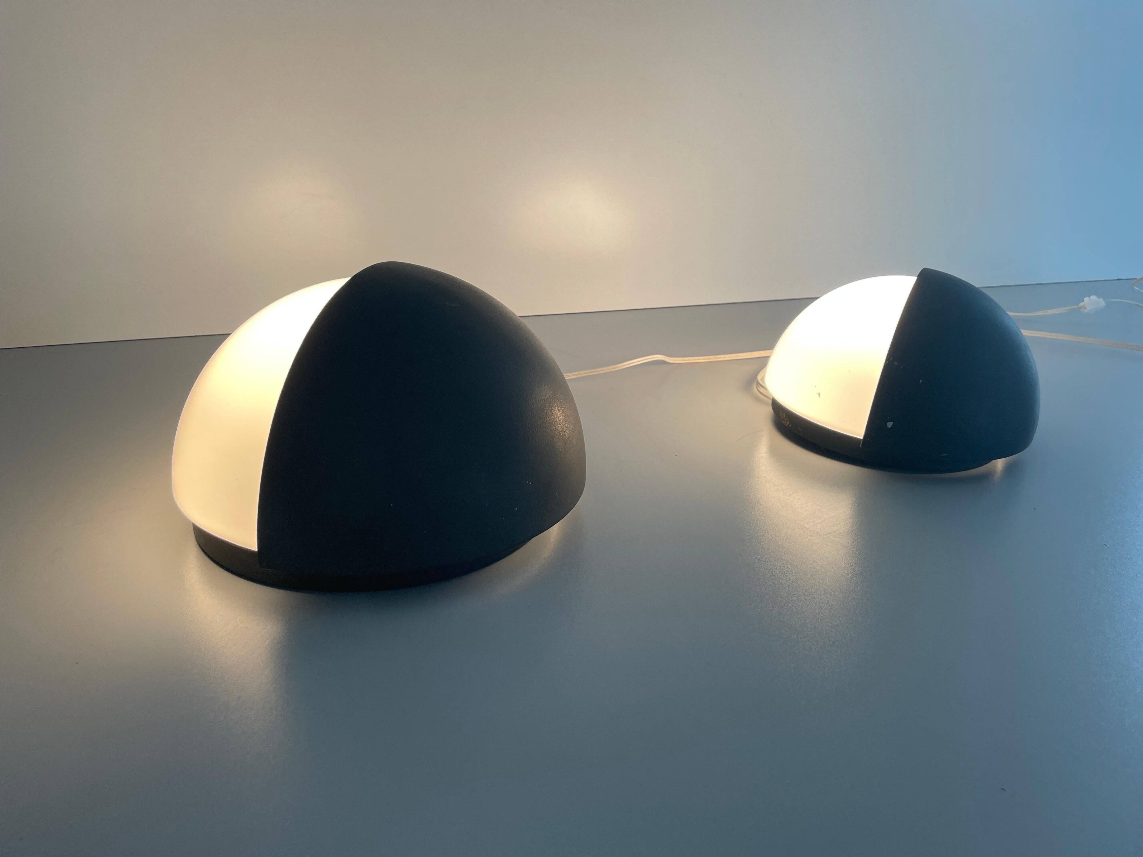 Round black metal wall lights, small and large set, by Bega, 1970s, Germany.