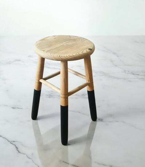 Solid wood stool with black legs