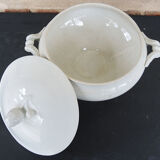 Old white ceramic soup bowl pine cone