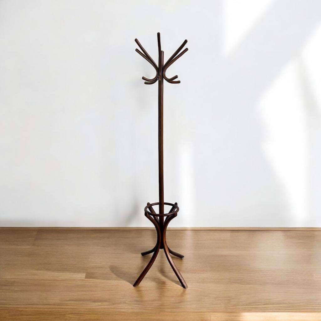 Vintage coat rack on floor in curved wood, thonet style