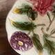 Ancienne assiette barbotine 3 fleurs art déco