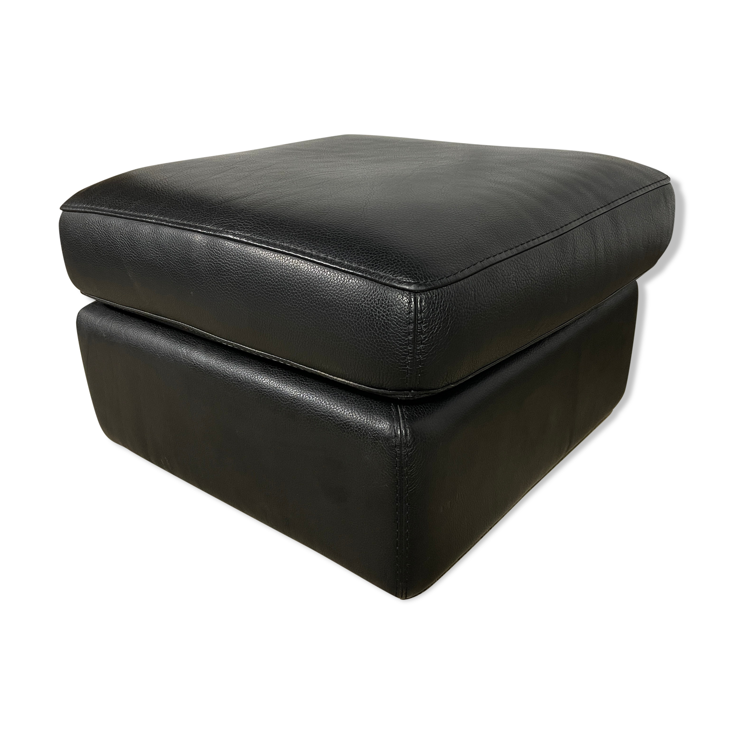 Black leather pouf