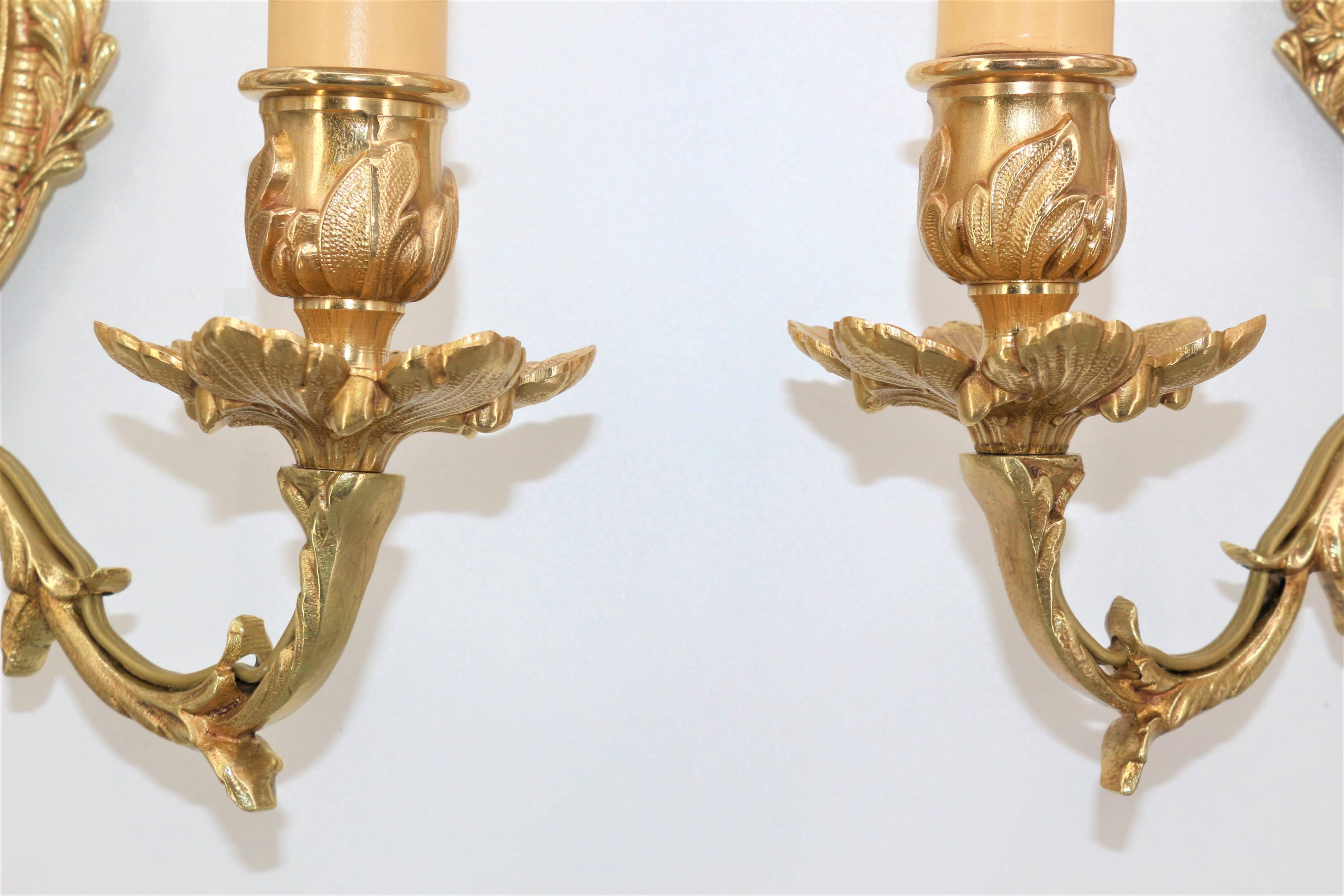 Pair of Louis XV style beveled mirror sconces in bronze by Lucien Gau
