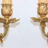 Pair of Louis XV style beveled mirror sconces in bronze by Lucien Gau
