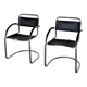 Vintage cantilever chairs in black saddle leather and chrome.