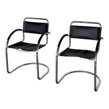 Vintage cantilever chairs in black saddle leather and chrome.
