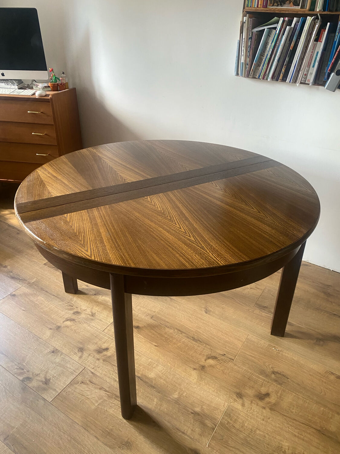 Table with an oak veneer and butterfly extension.