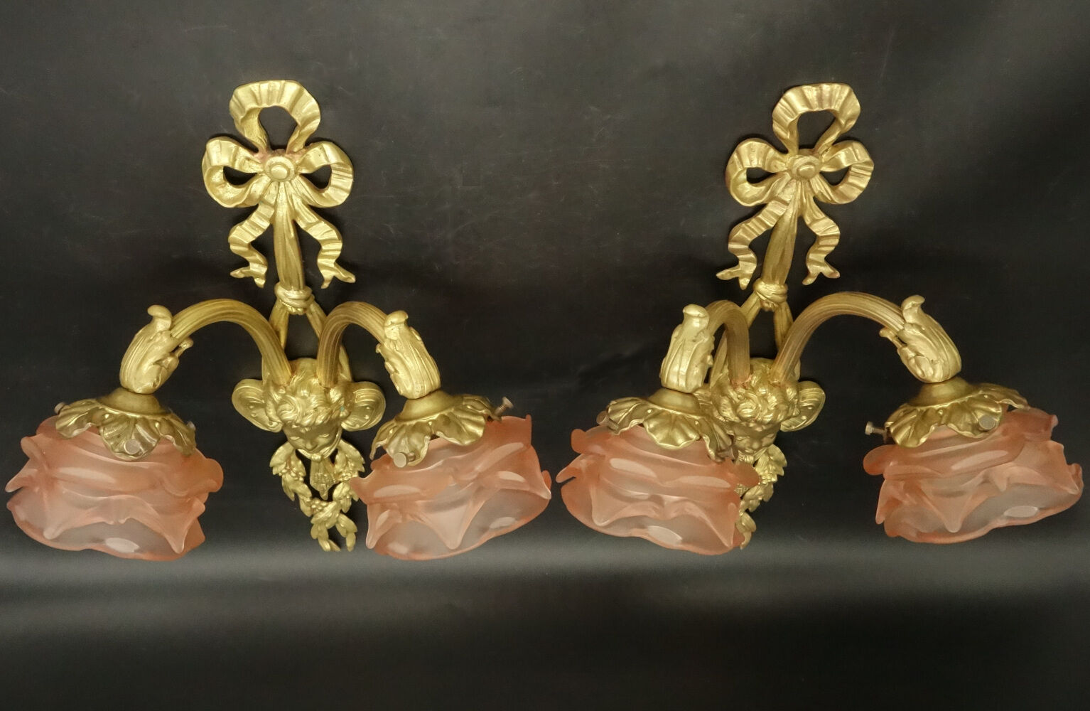 Pair of sconces with the heads of Zephyr Louis XVI style