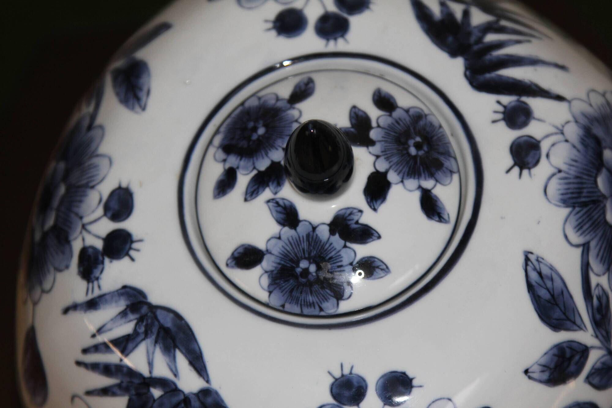 A pair of Chinese blue and white ovoid vases and flush-fitting circular covers