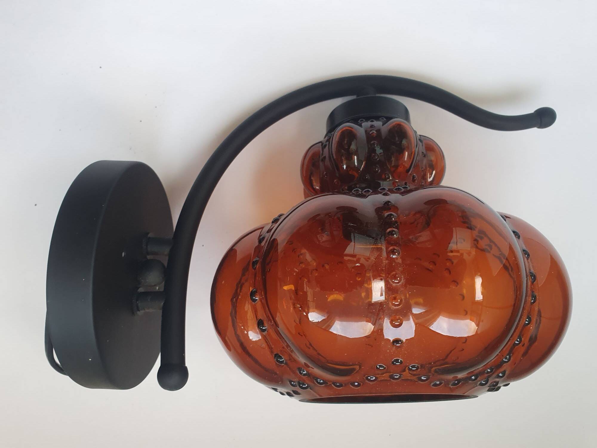 Three large vintage brown glass wall lights