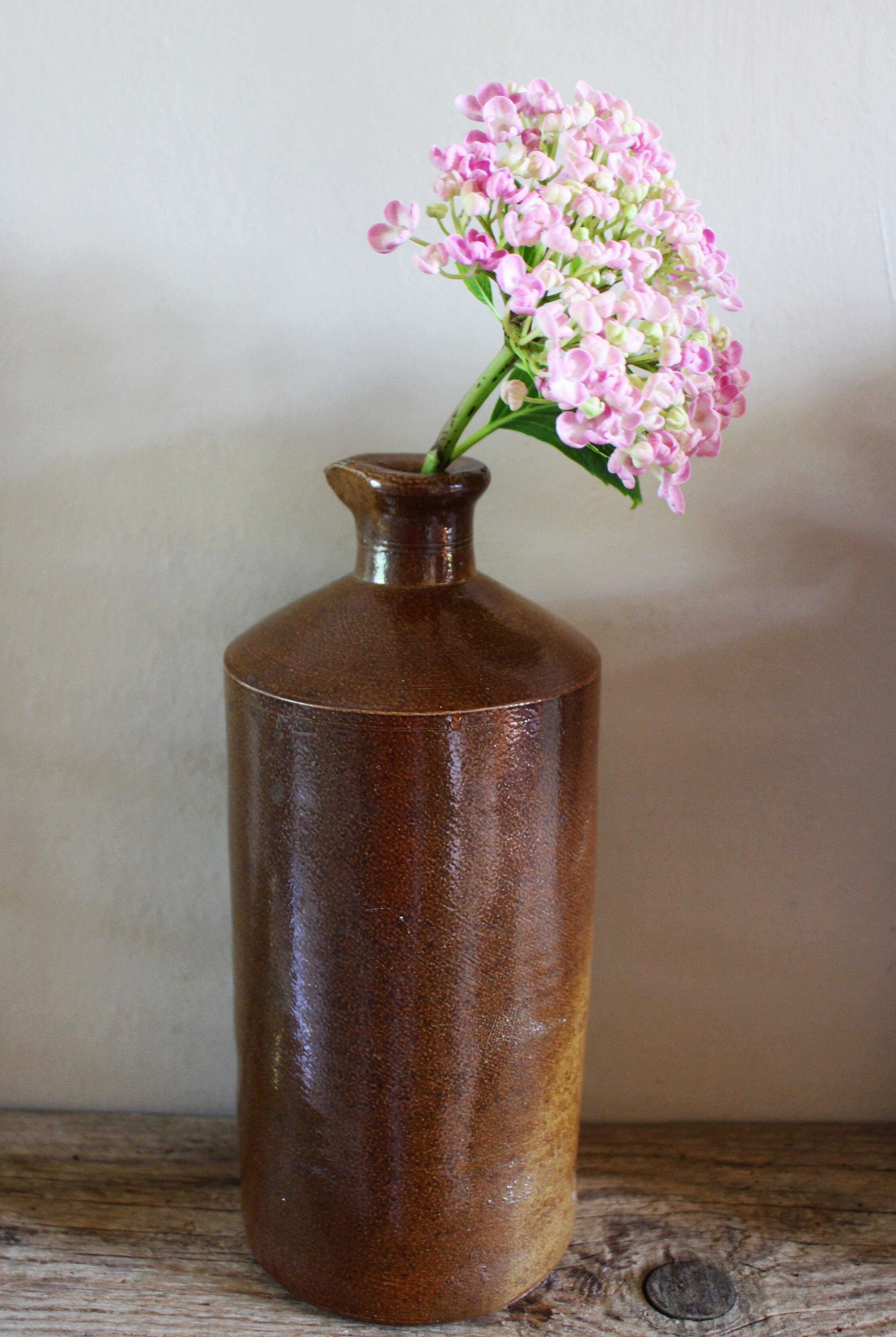 Vintage Bourne Deney stoneware liqueur bottle with pouring spout.