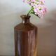Vintage Bourne Deney stoneware liqueur bottle with pouring spout.