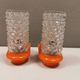 Bathroom lamps in a nice orange colour with a crystal glass shade and a base of hard thin plastic