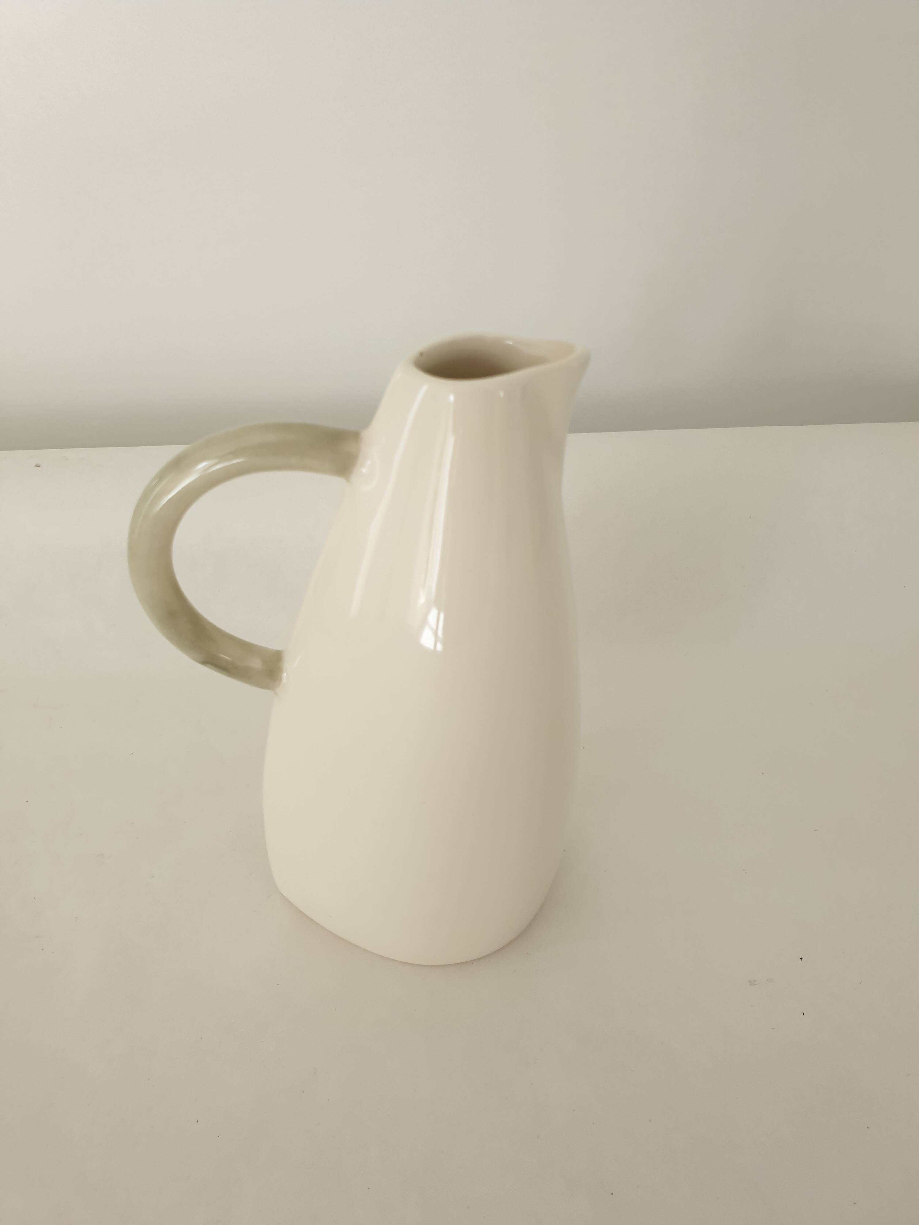 White earthenware pitcher signed KG Lunéville