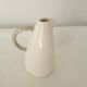 White earthenware pitcher signed KG Lunéville