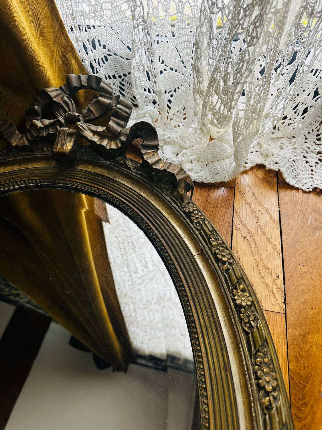 Large antique oval mirror