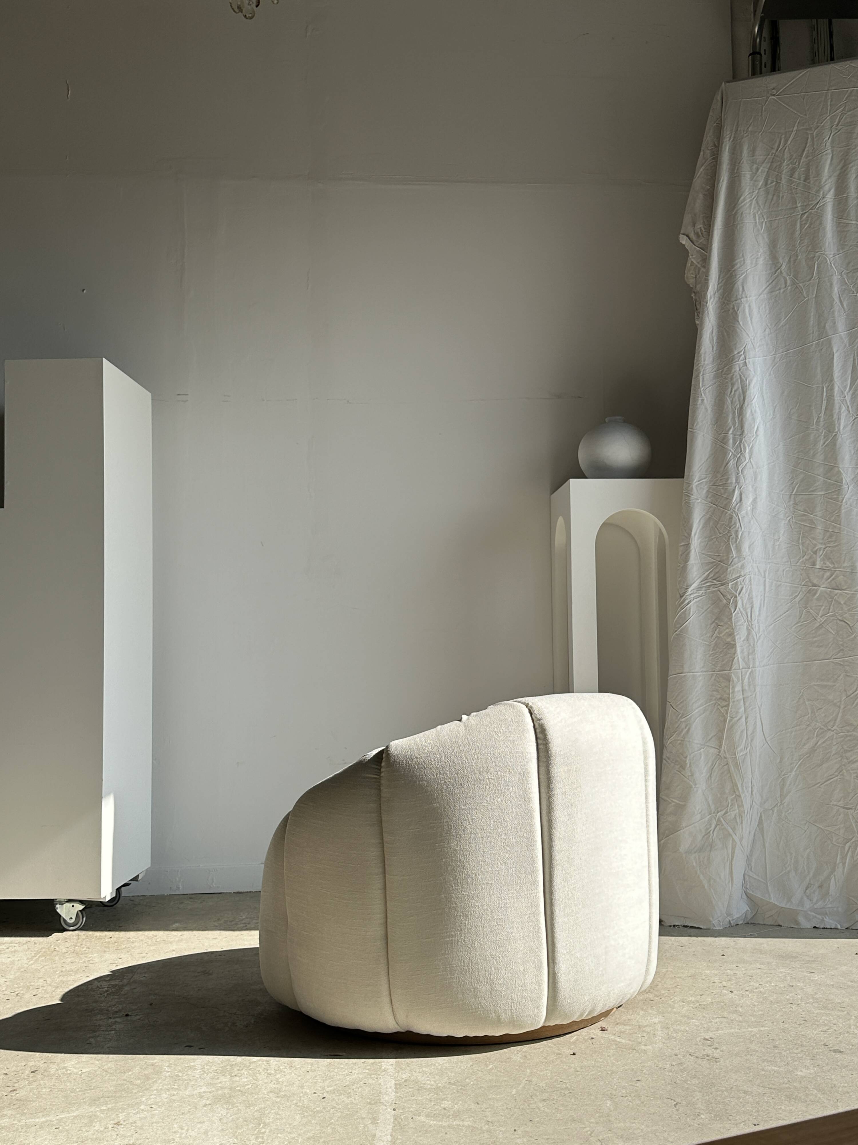Large white circular armchair, white fabric upholstery