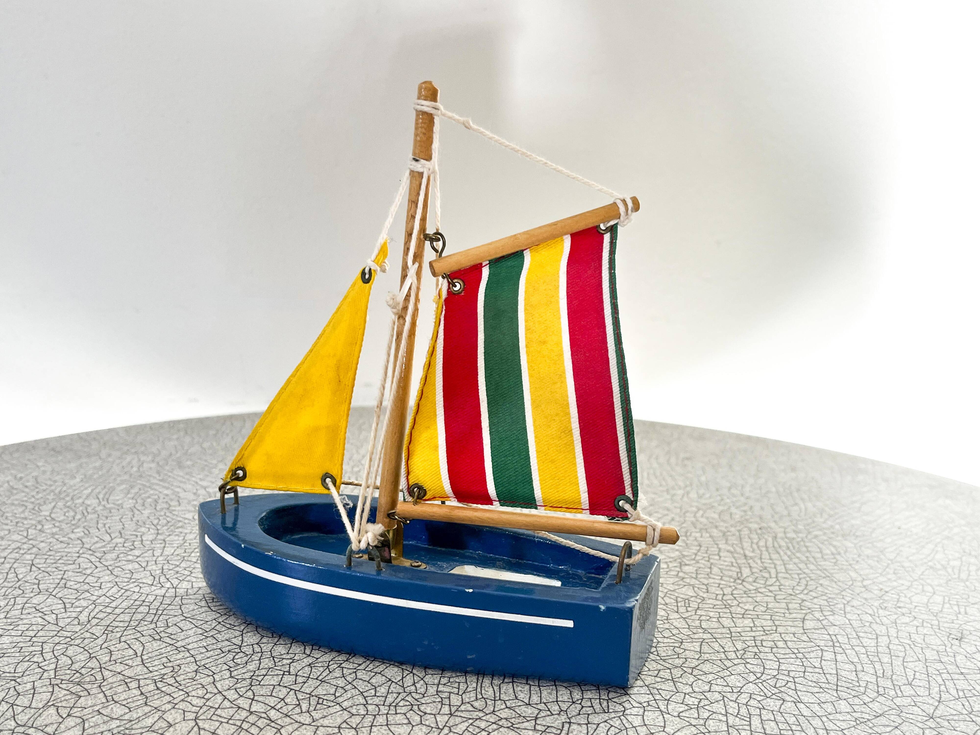Wooden bathtub sailboat, perhaps a Tirot.
